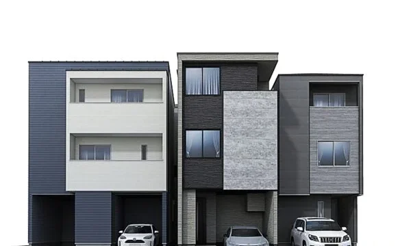 Three modern attached townhouses with garages and cars parked in front of each unit.